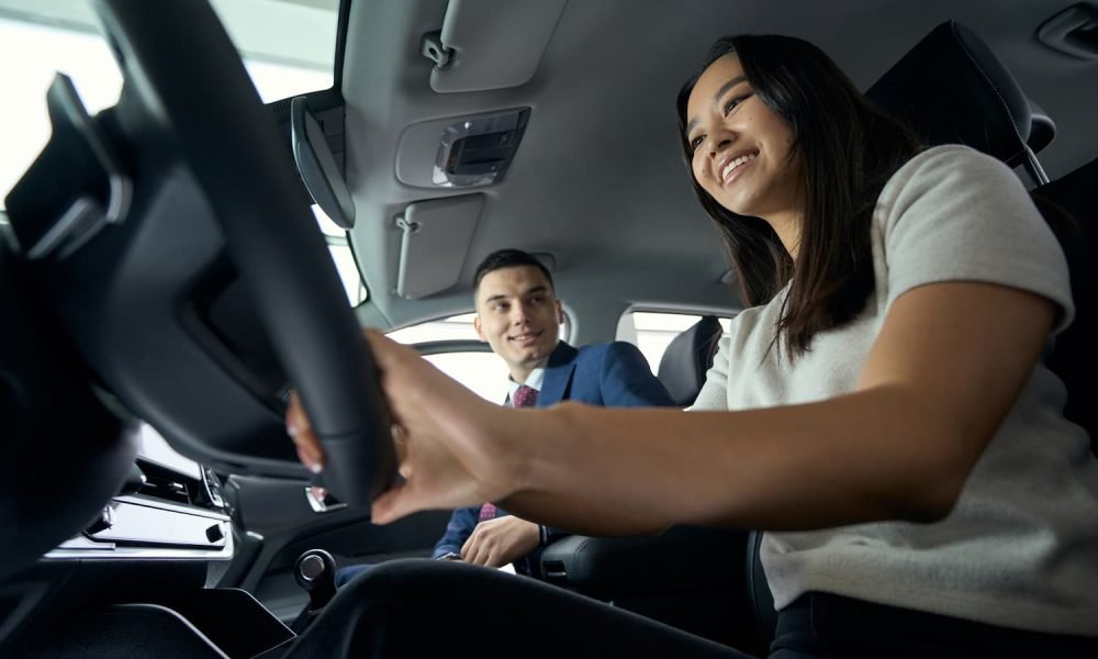 charming-woman-sits-behind-the-wheel-in-the-driver-2024-10-18-11-28-09-utc.jpg